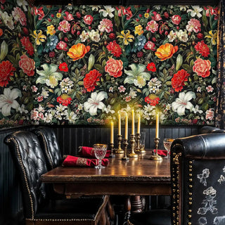 Rich floral wallpaper with exotic flowers shown in elegant dining room with candlelit table setting