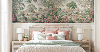Romantic floral garden mural with giraffes and blooming trees above a distressed cane headboard bedroom