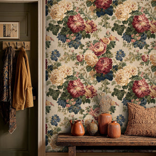 Romantic floral wallpaper with burgundy and navy blooms, displayed in rustic entryway with hanging coat hooks