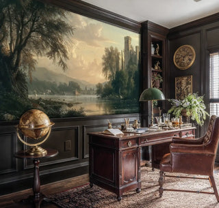 Romantic landscape wall mural with castle towers and valley, shown in elegant study with antique globe