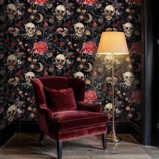 Romantic skull and flower wallpaper in sophisticated reading chair nook with brass floor lamp