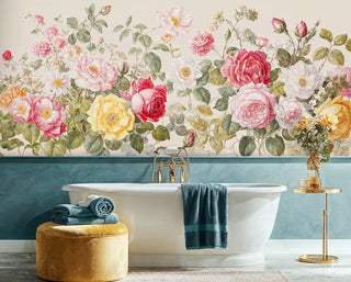Rose garden wallpaper with watercolor florals in pink and yellow, shown in luxury bathroom with freestanding tub