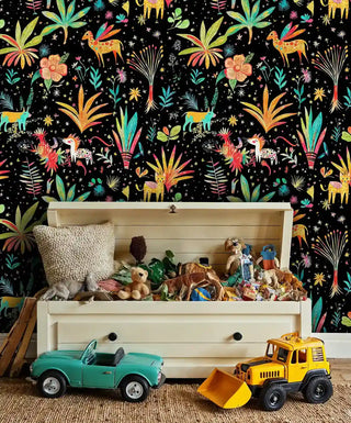 Safari adventure wallpaper featuring exotic animals on black background, displayed in kids room with wooden toy chest and vintage cars