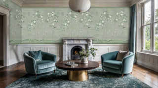 Sage chinoiserie wallpaper featuring songbirds and blooming branches in classic living room with fireplace