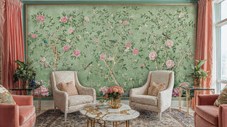 Sage green chinoiserie wallpaper with pink florals, featured in luxurious sitting room with coral accents