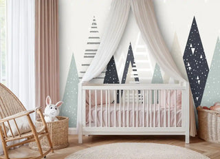 Scandinavian geometric wallpaper displaying stylized mountains with dots and stripes, in serene nursery with white crib and canopy