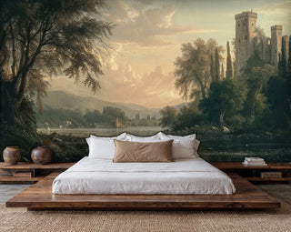 Scenic castle landscape mural featuring golden sky and river, displayed behind modern low platform bed