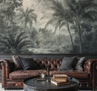 Scenic jungle etching wall mural with layered canopy in green tones, in a living room with Chesterfield sofa