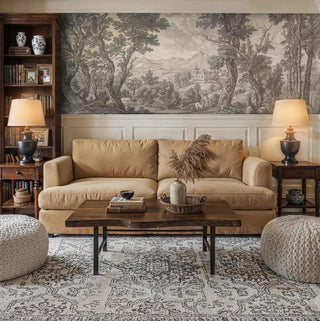Scenic landscape wallpaper featuring detailed trees and rolling hills, traditional living room with built-in shelves