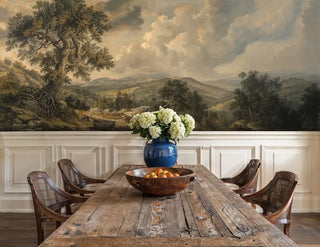 Scenic valley wallpaper featuring pastoral landscape with dramatic sky, displayed in dining room with blue vase