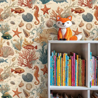 Sea life wallpaper featuring starfish and shells, displayed in reading nook with fox toy on white bookshelf
