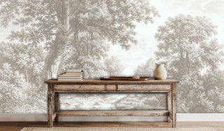 Sepia pastoral wallpaper with trees and gate details, displayed behind rustic wooden console table