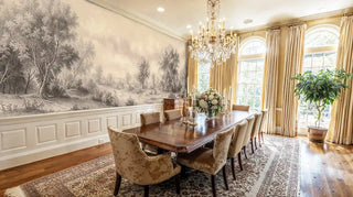 Sepia scenic wallpaper featuring pastoral landscape with trees, displayed in elegant dining room with crystal chandelier