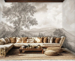 Sepia-toned pastoral wall mural featuring gnarled trees and countryside vista in modern living room with sectional sofa