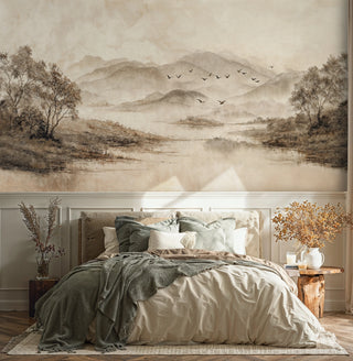 Serene mountain lake Wall Mural in soft beige and brown tones, shown in cozy bedroom with sage bedding