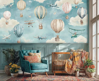 Sky adventure wallpaper featuring floating balloons and biplanes in blue and cream colors, shown in an elegant nursery with teal velvet chair