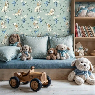 Spaniel and rose garden wallpaper with cream spaniels and blue ribbons, shown in nursery with wooden shelving