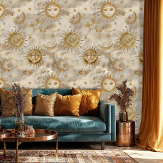 Sun moon stars wallpaper with ornate golden celestial motifs displayed in living room with teal velvet sofa and brass accents