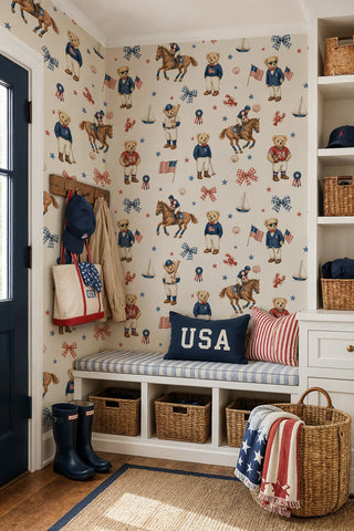 Teddy bear wallpaper with flags, bows, and horses in navy red and ivory, in an entryway mudroom with coat hooks and bench