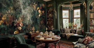 Textured botanical wall mural featuring aged florals on emerald background in traditional study with round tea table