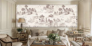 Toile pastoral wall mural featuring countryside vignettes in brown and cream, in an elegant living room with white sofa and glass coffee table