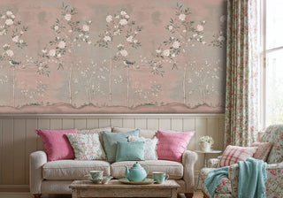 Traditional garden scene wallpaper showing birds and blooming branches, in cozy cottage living room with floral tea set