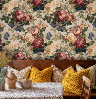 Traditional peony wallpaper in burgundy and cream tones, shown in cozy dining nook with wooden bench seating