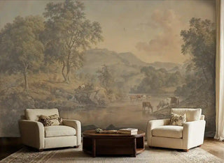 Tranquil countryside wall mural featuring peaceful cattle scene and rolling landscape, shown in refined sitting room with cream armchairs and round coffee table