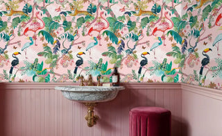 tropical animal wallpaper featuring tigers and toucans among lush foliage in elegant powder room with marble sink