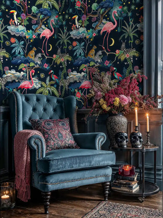 Tropical animal wallpaper with flamingos and zebras on navy, styled in gothic living room with skull decorations