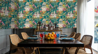Tropical architectural wallpaper featuring golden temples and lush gardens, shown in elegant dining room with bar cart
