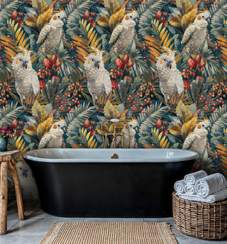 Tropical bird wallpaper featuring cockatoos and red berries in luxurious bathroom with black freestanding tub