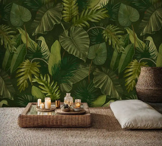 Tropical botanical wall mural with monstera and palm leaves, shown in zen meditation room with floor cushions