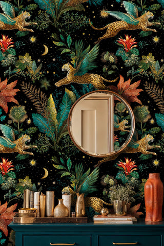 tropical celestial wall mural with winged cats and coral flowers, styled with round mirror and brass accessories