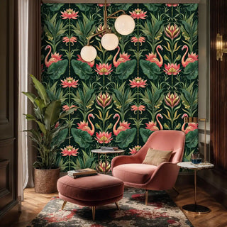 Tropical flamingo wallpaper with pink flamingos and lotus flowers on dark green, in elegant sitting room with coral chair