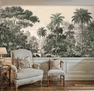 Tropical jungle wall mural featuring elephants near a stone bridge, displayed in a French-style room with wingback chair