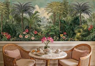 Tropical jungle wallpaper featuring palms and exotic blooms in elegant dining nook with cane chairs