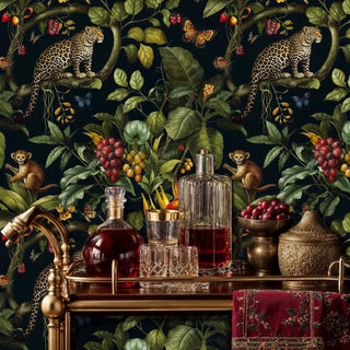 Tropical leopard wallpaper with spotted big cats and lush foliage, shown on bar cart with crystal decanters