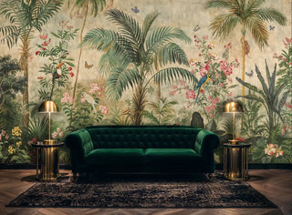 Tropical mural showing palm trees and colorful parrots, featured in luxurious room with emerald velvet sofa