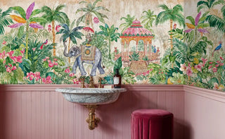 Tropical paradise wall mural featuring elephant and lush botanicals in powder room with marble sink