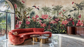 Tropical paradise wallpaper featuring flamingos and coral blooms in modern living room with curved red velvet sofa