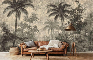 Tropical paradise wallpaper featuring weathered palms and botanicals, displayed behind leather sofa