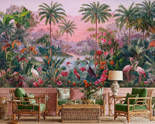 Tropical paradise wallpaper with flamingos and exotic birds in pink sunset, shown in elegant living room with rattan furniture