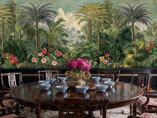 Tropical rainforest wallpaper showing palm trees and flowers in formal dining room with round table