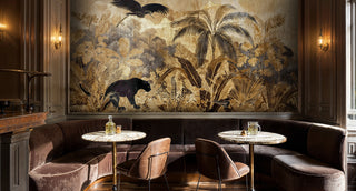 Tropical safari wall mural featuring golden palms, black panthers, and exotic birds, shown in an elegant dining booth