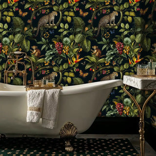 Tropical safari wallpaper featuring leopards and lush plants, displayed in luxury bathroom with clawfoot tub