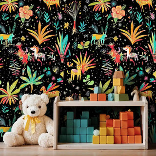 Tropical safari wallpaper with bright animals and florals, shown in playroom with wooden toy cart and colorful building blocks