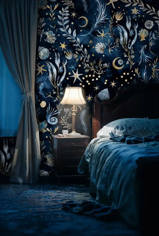Underwater celestial wallpaper with shells and gold stars, displayed in cozy bedroom with bedside lamp