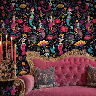 Vibrant Day of the Dead mermaid wallpaper with coral blooms, displayed in opulent bedroom with ornate pink velvet sofa