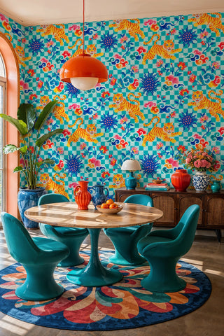 Vibrant tiger wallpaper on teal checkered ground with sun motifs, in a dining room with orange pendant lamp